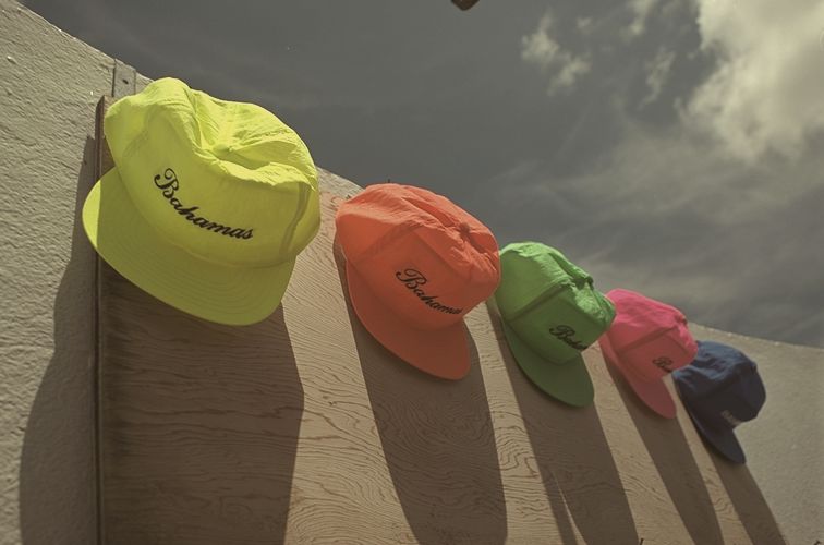 Bright caps lined up on a wall