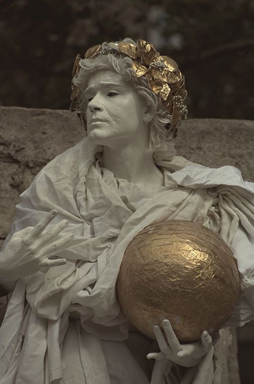 Performer painted as a marble statue