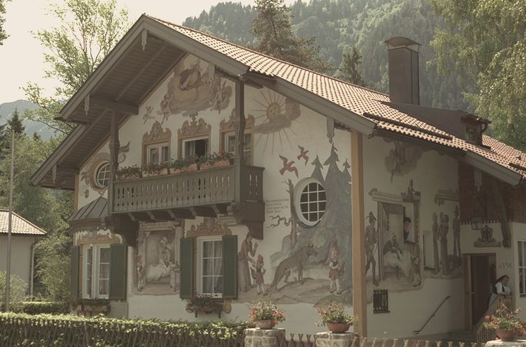 Alpine house with painted murals